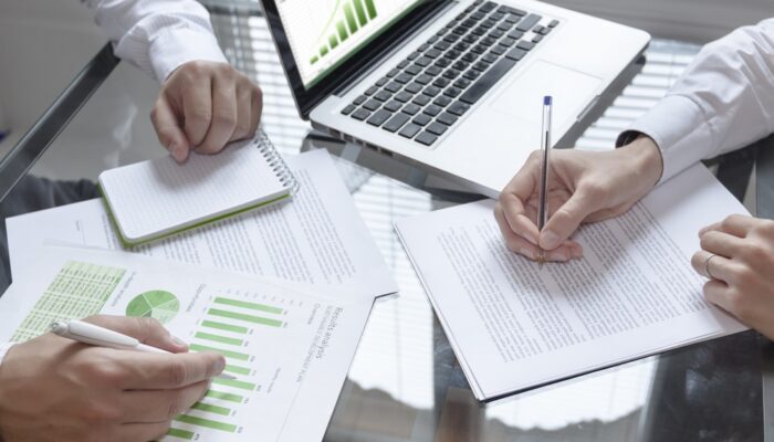 Business,Meeting,About,Sustainable,Development,With,Laptop,And,Notepad